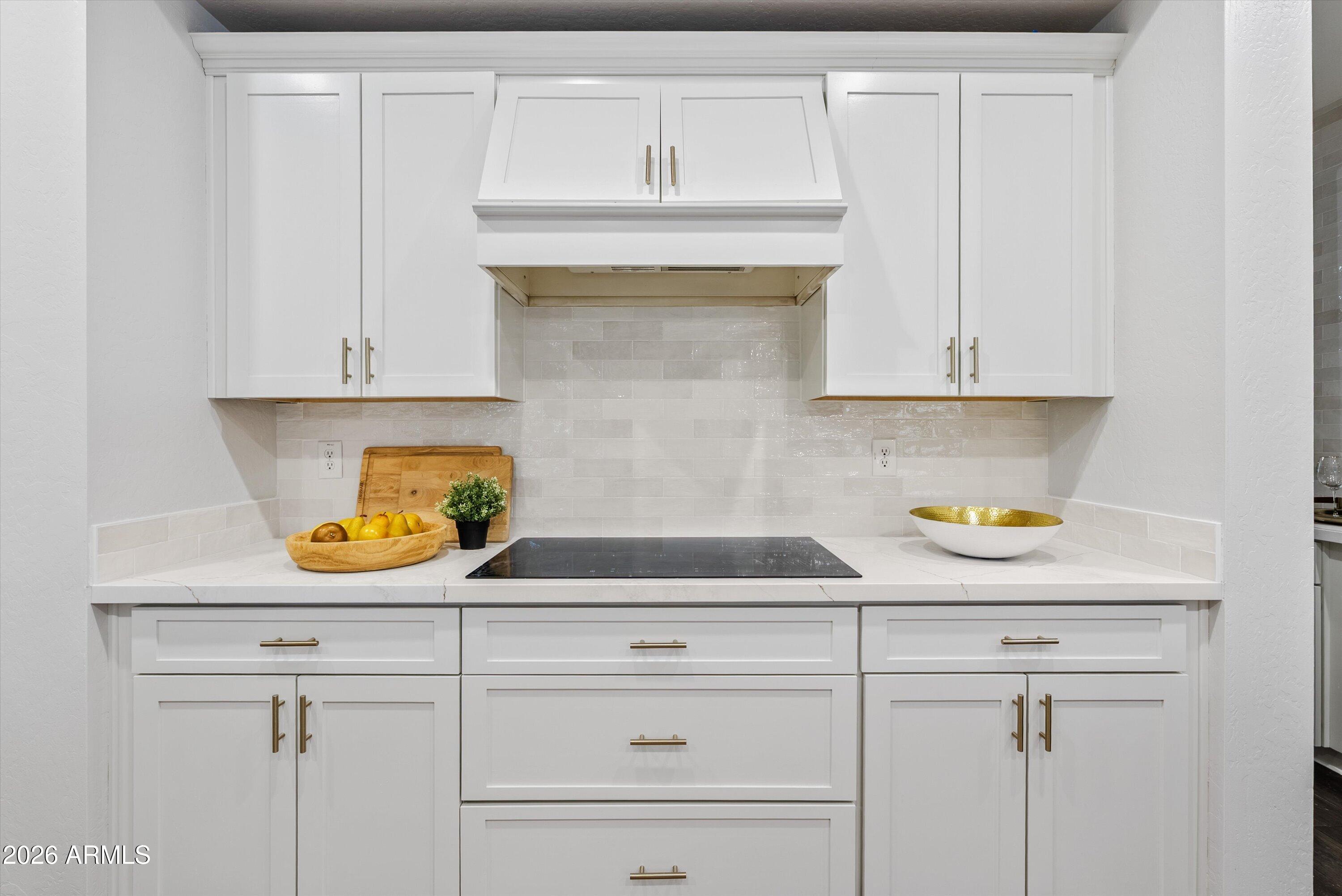 3112 East Agritopia Loop North Gilbert, AZ 85296 - Photo 2 of 40 a kitchen with white cabinets and a sink