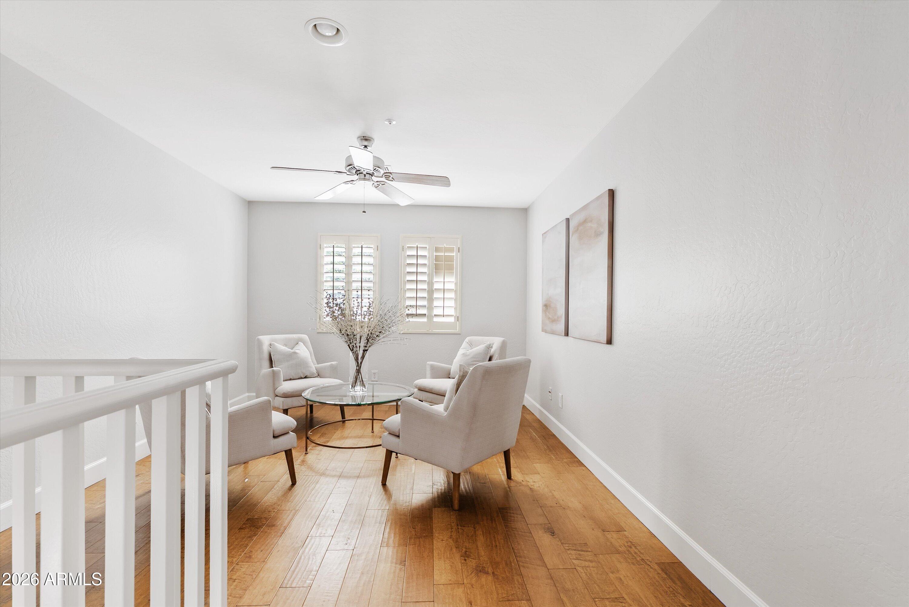 3112 East Agritopia Loop North Gilbert, AZ 85296 - Photo 24 of 40 a view of a dining room with furniture window and wooden floor