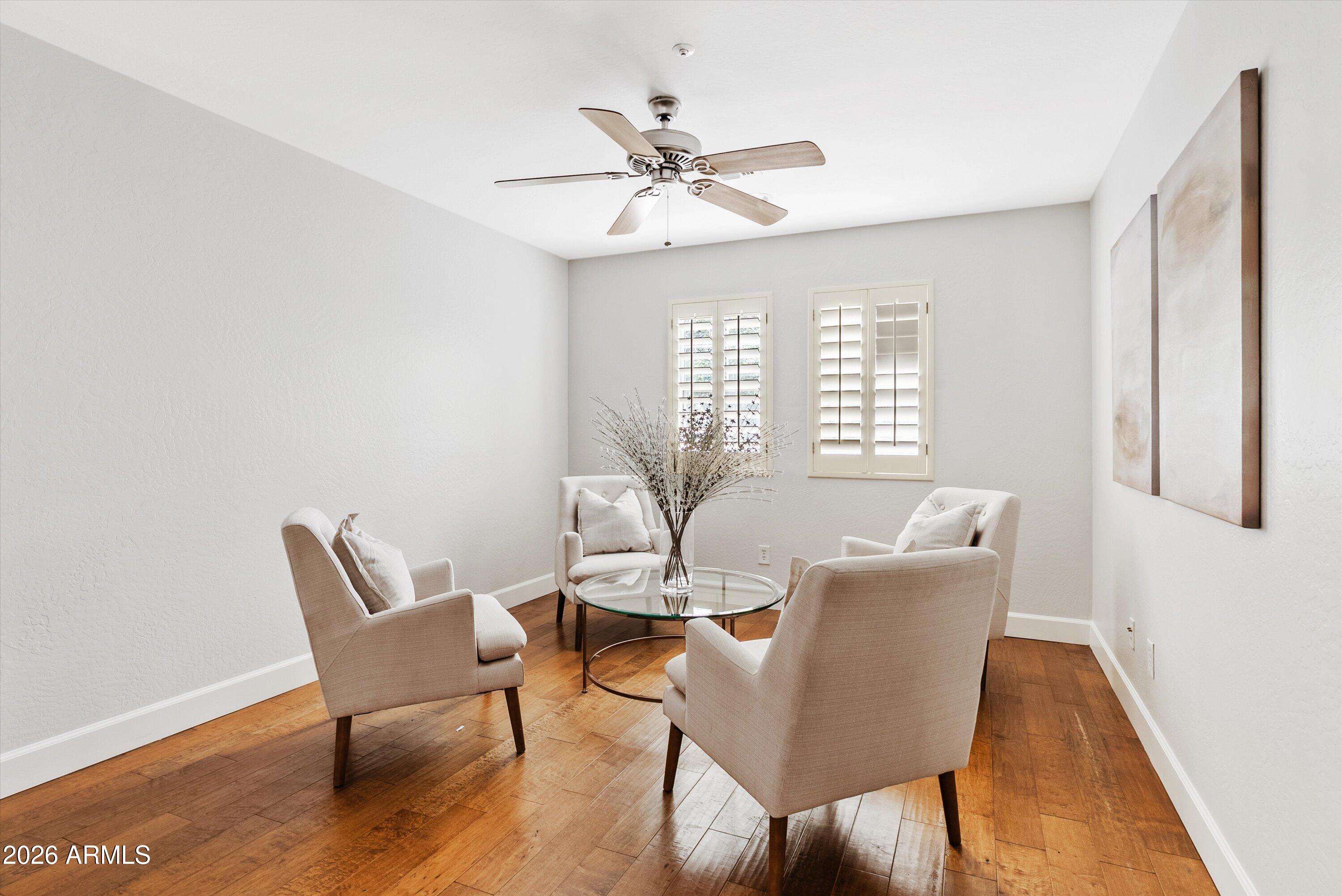 3112 East Agritopia Loop North Gilbert, AZ 85296 - Photo 25 of 40 a view of a dining room with furniture window and wooden floor