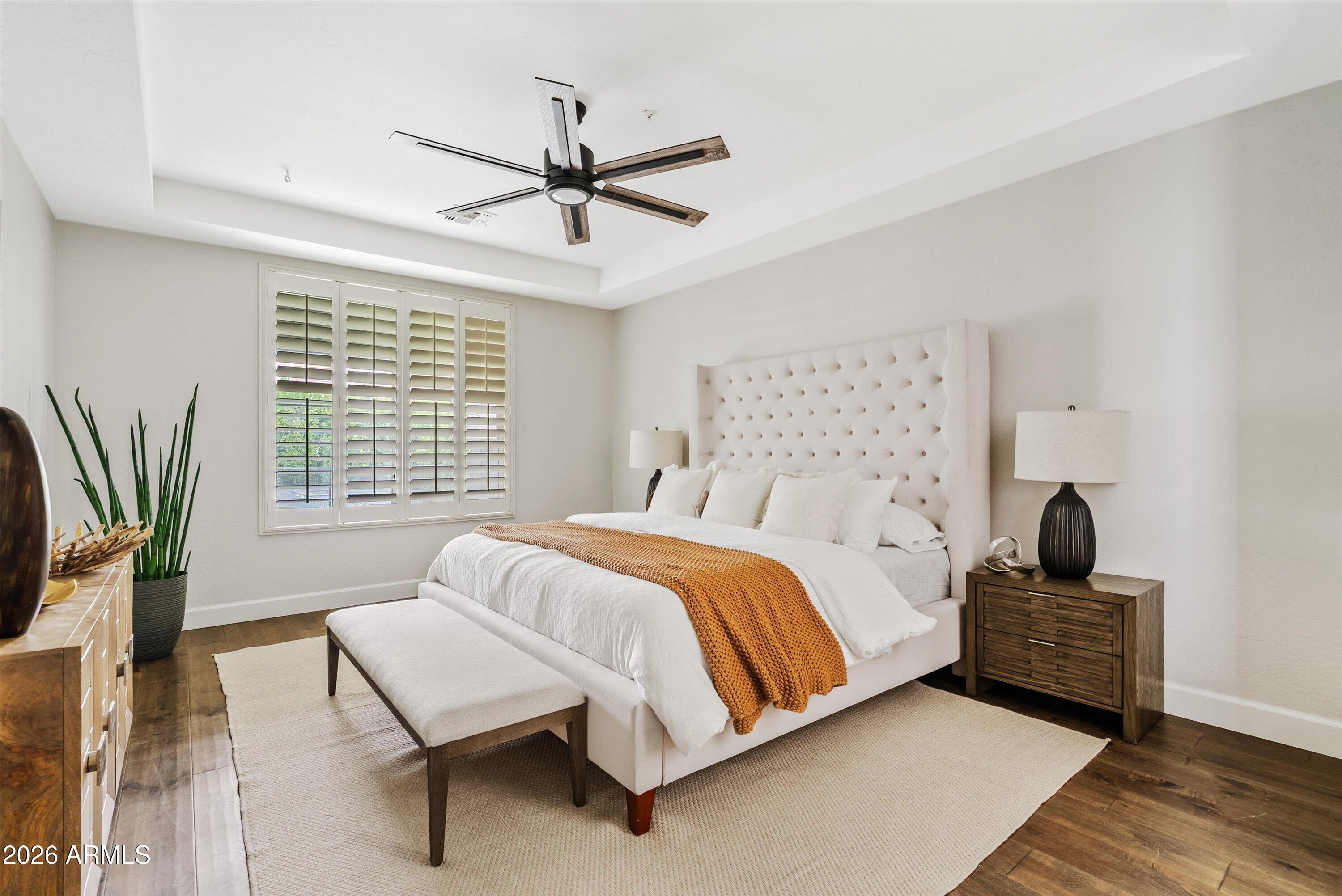 3112 East Agritopia Loop North Gilbert, AZ 85296 - Photo 3 of 40 a bedroom with a bed and wooden floor