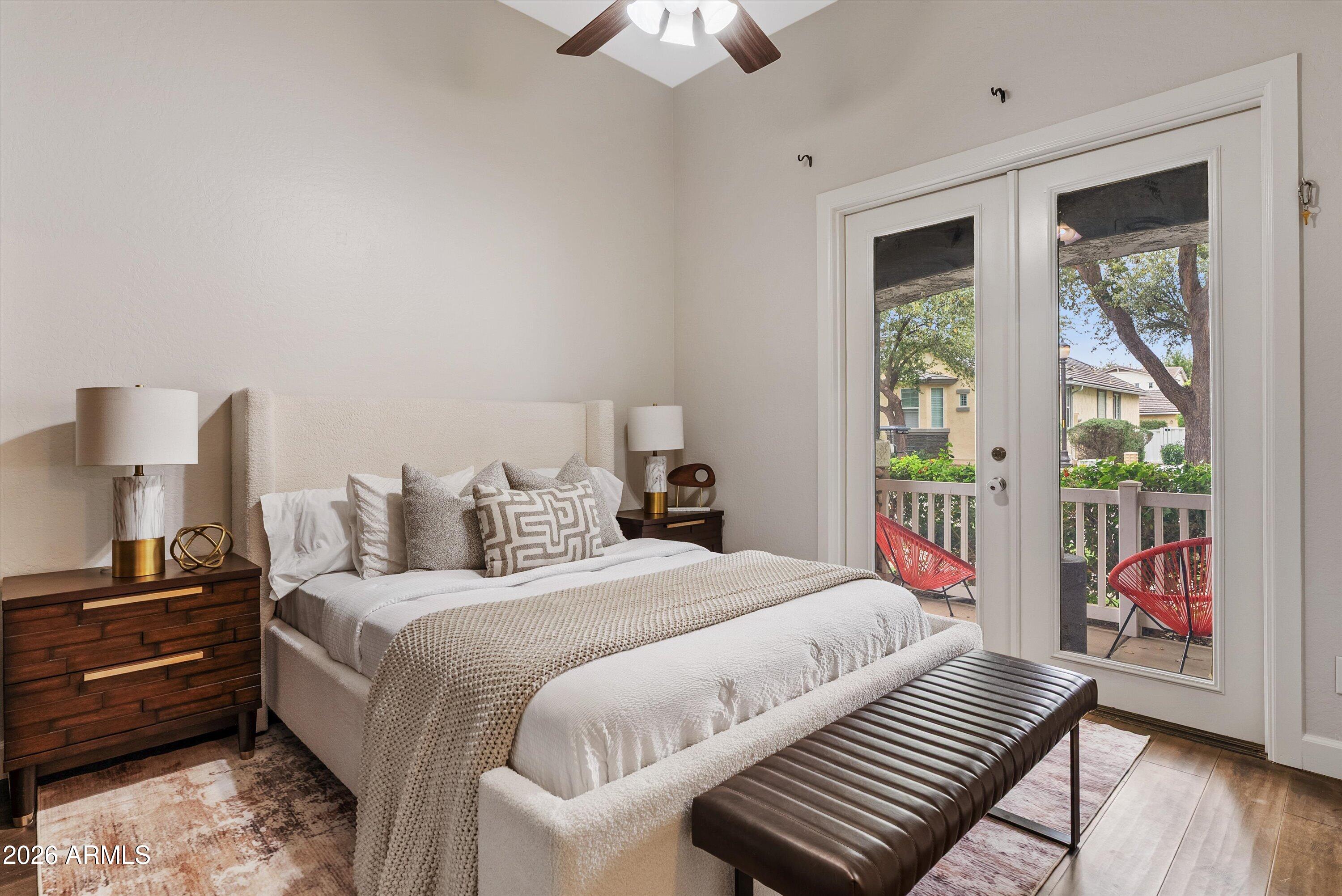 3112 East Agritopia Loop North Gilbert, AZ 85296 - Photo 7 of 40 a bedroom with a bed next to a large window