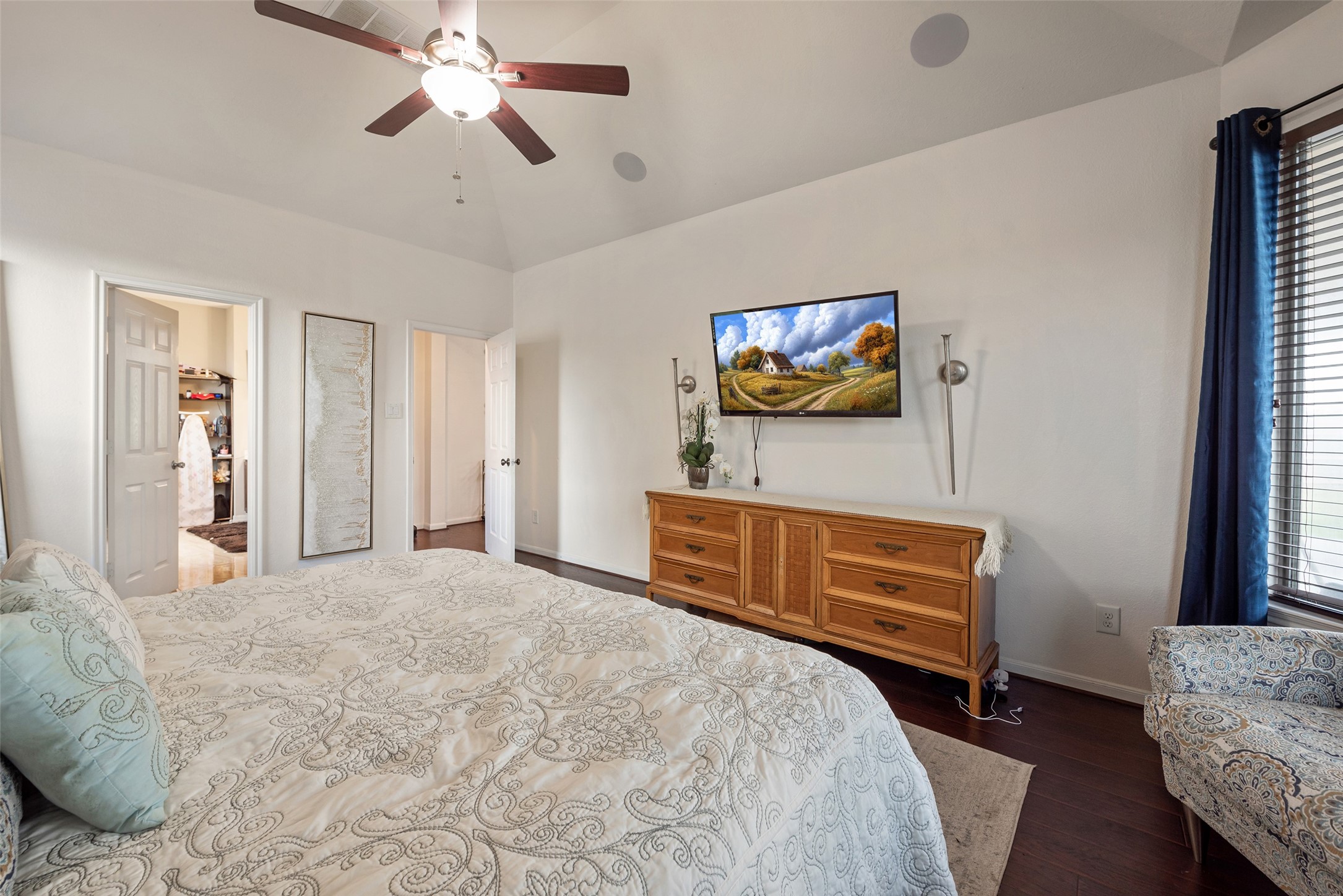 3554 Bennett Trails Drive Spring, TX 77386 - Photo 21 of 44 a bedroom with a bed and a chandelier