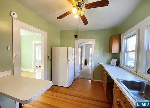a view of a kitchen with furniture and a window