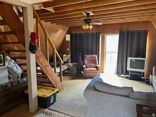 45720 Airport Road Fruitland, UT 84027 - Photo 5 of 22 Living area featuring wood walls, a ceiling fan, and carpet floors