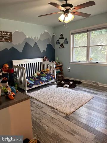 a bedroom with furniture and a window