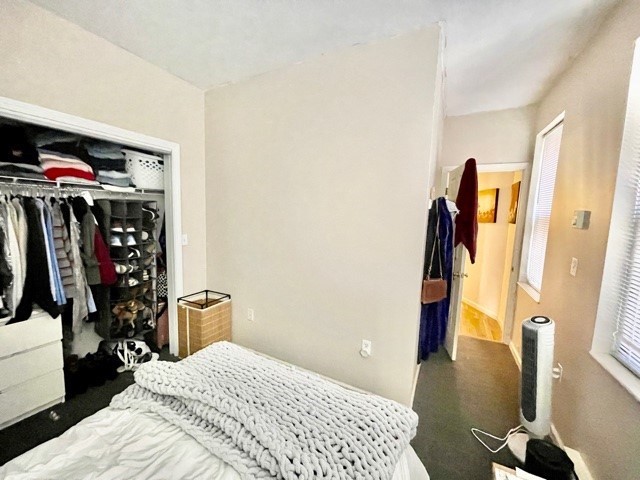 17 Thacher Street, Unit 3 Boston, MA 02113 - Photo 22 of 24 a bedroom with a bed and a view of walk in closet