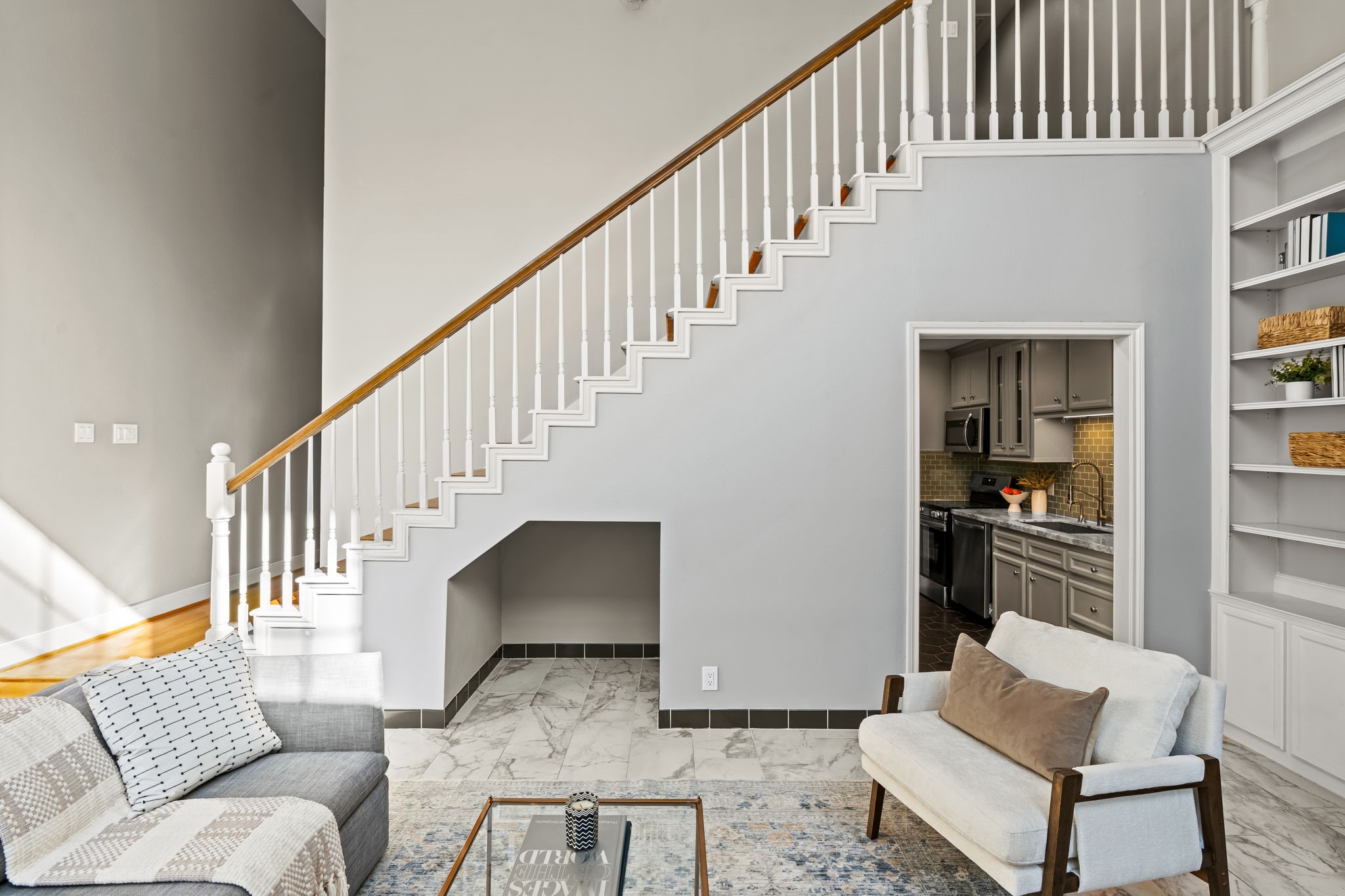 254 East 5th Street Houston, TX 77007 - Photo 11 of 31 The open staircase and elevated sightlines add depth and dimension to the main living area. With only one shared interior wall, the home enjoys enhanced privacy and natural light.