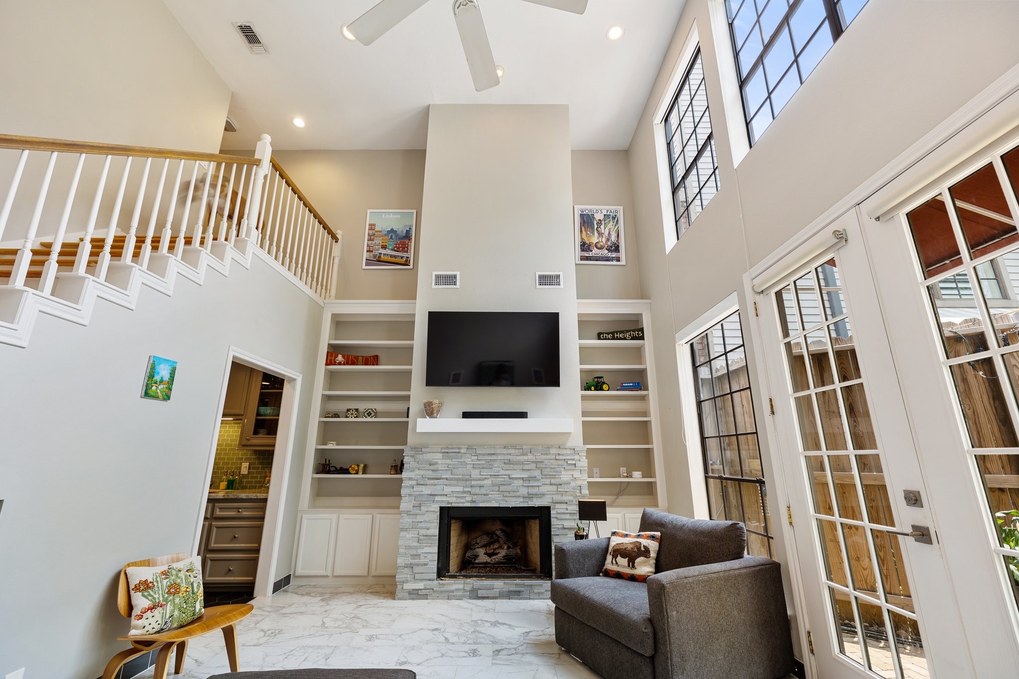 254 East 5th Street Houston, TX 77007 - Photo 17 of 40 a living room with furniture a flat screen tv and a fireplace