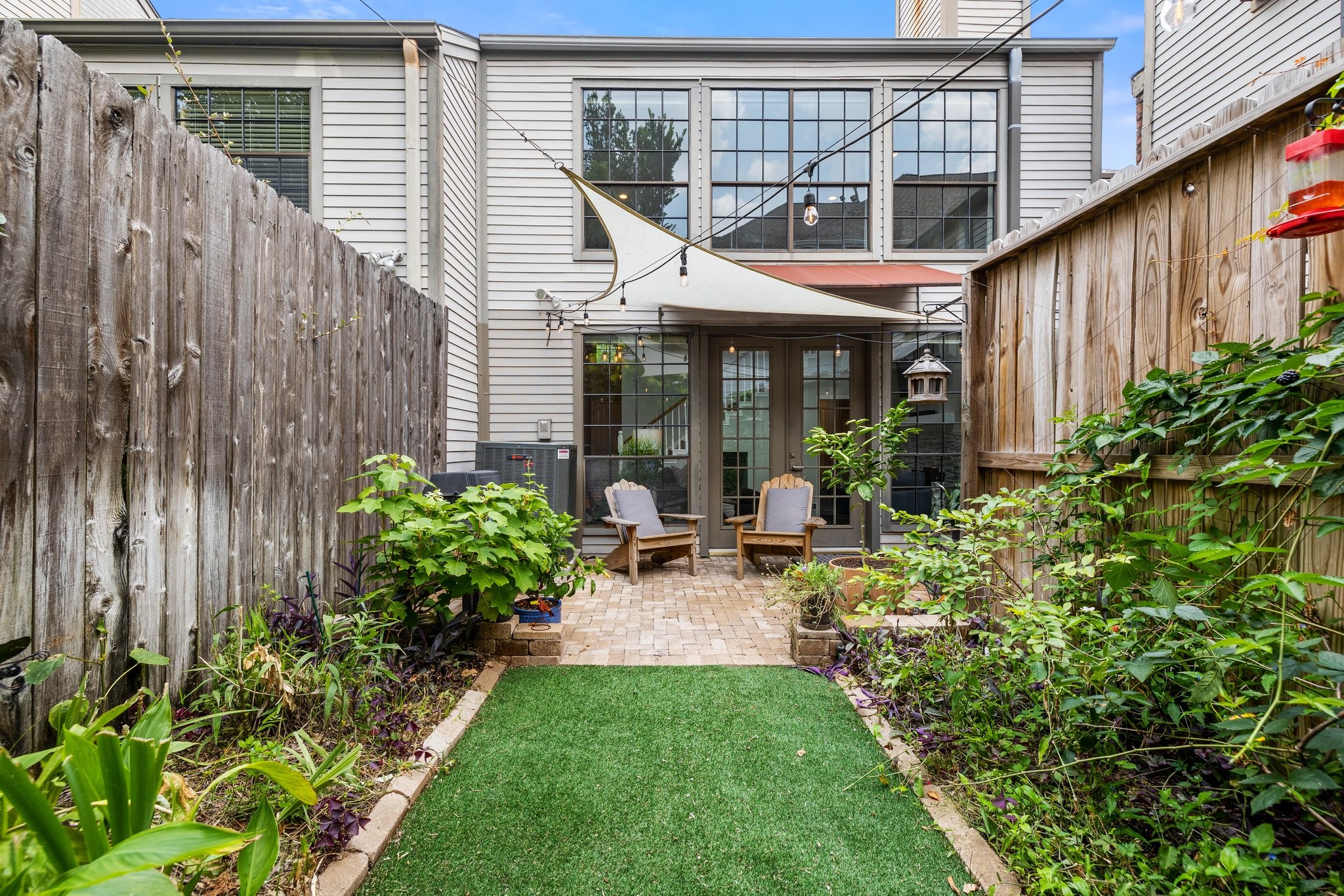 254 East 5th Street Houston, TX 77007 - Photo 2 of 40 a view of a chair and table in backyard of the house