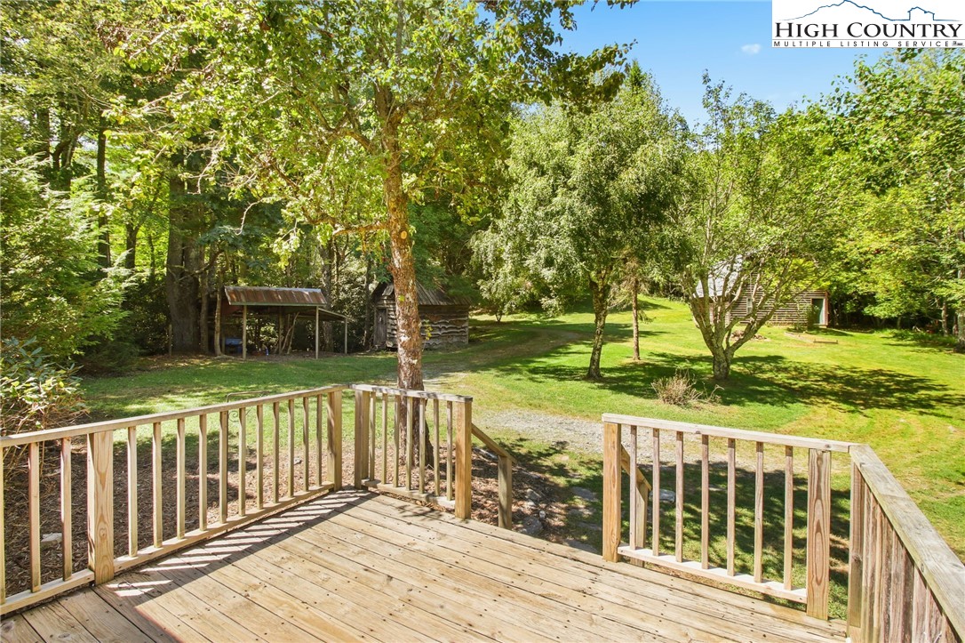 2166 George Hayes Road Boone, NC 28607 - Photo 14 of 50 a view of a wooden deck and a yard with swimming pool