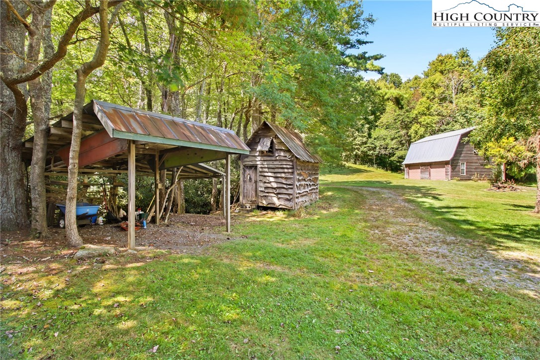2166 George Hayes Road Boone, NC 28607 - Photo 15 of 50 a view of a house with a yard porch and sitting area