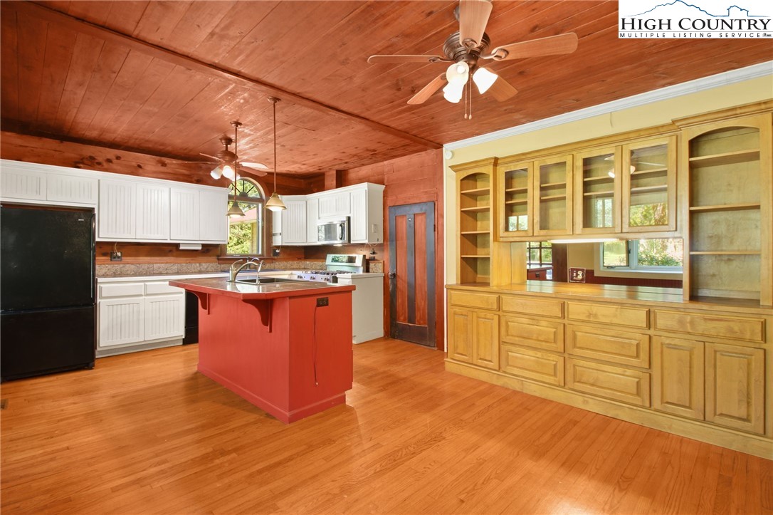 2166 George Hayes Road Boone, NC 28607 - Photo 23 of 50 a kitchen with stainless steel appliances granite countertop a stove and a refrigerator