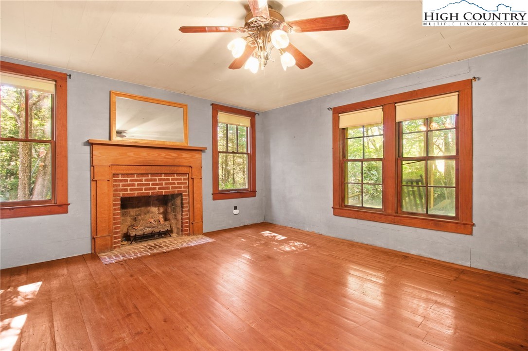 2166 George Hayes Road Boone, NC 28607 - Photo 27 of 50 a view of an empty room with window and fire place