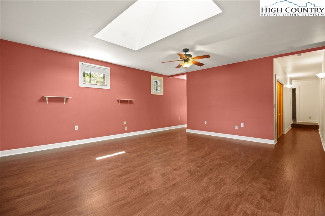 2166 George Hayes Road Boone, NC 28607 - Photo 34 of 50 an empty room with wooden floor and windows