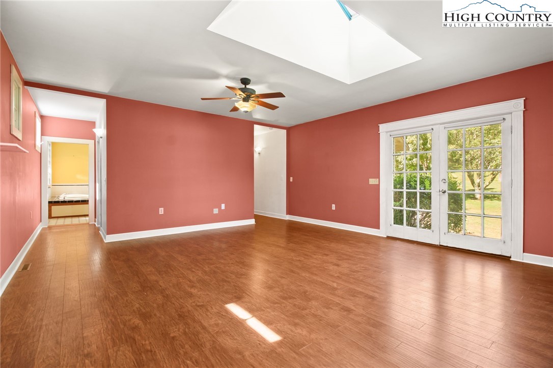 2166 George Hayes Road Boone, NC 28607 - Photo 35 of 50 a view of an empty room with wooden floor and a window