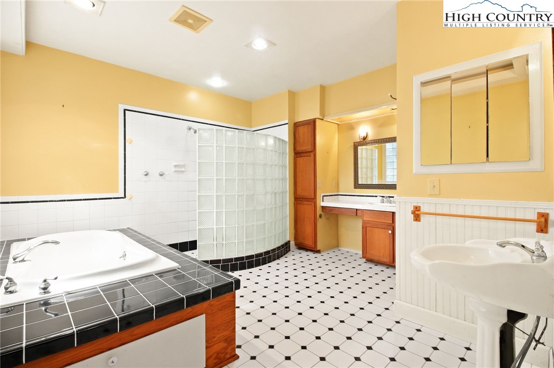 2166 George Hayes Road Boone, NC 28607 - Photo 36 of 50 a bathroom with a sink toilet and shower