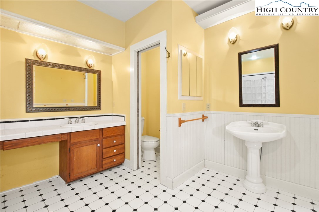 2166 George Hayes Road Boone, NC 28607 - Photo 39 of 50 a bathroom with a sink a mirror and a shower