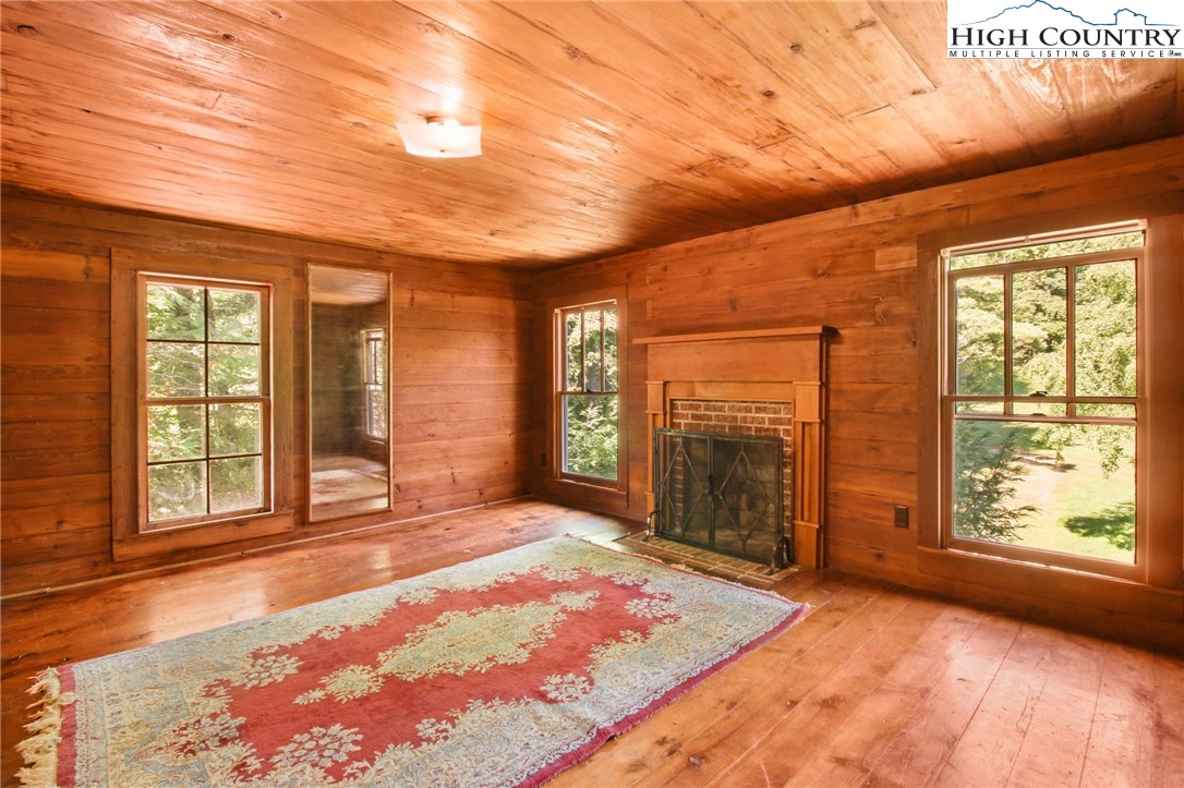 2166 George Hayes Road Boone, NC 28607 - Photo 45 of 50 a view of an empty room with a fireplace and a window