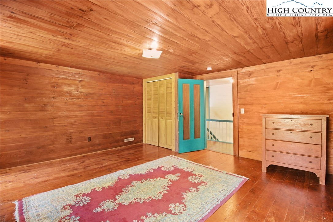 2166 George Hayes Road Boone, NC 28607 - Photo 47 of 50 a bedroom with a bed and a dresser