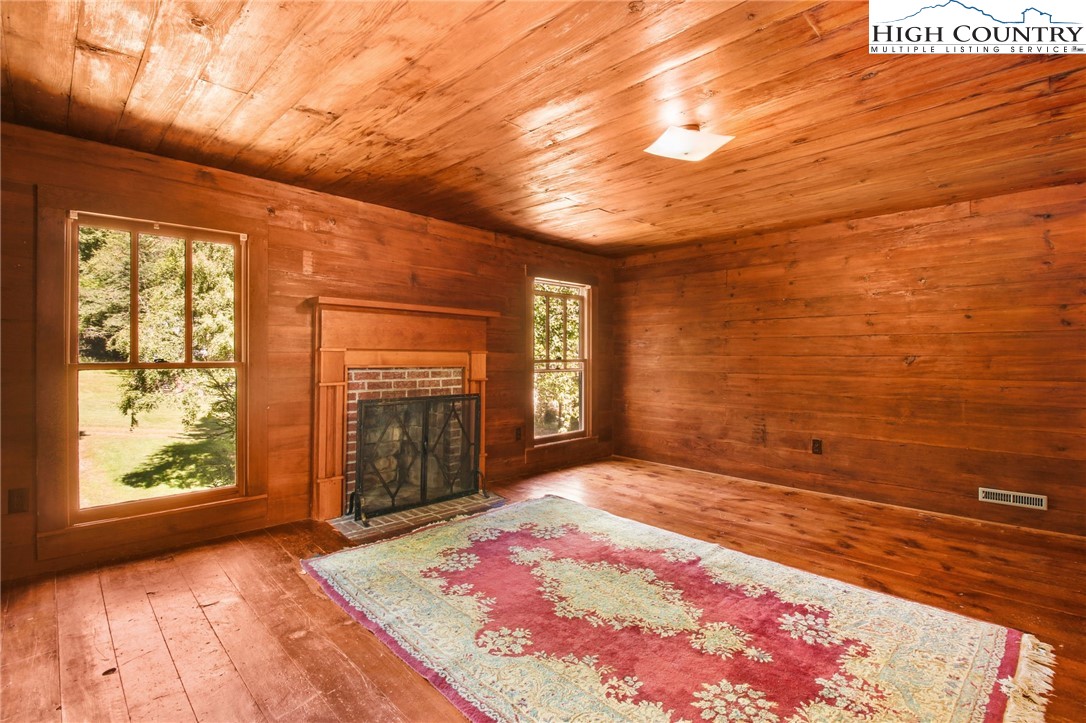 2166 George Hayes Road Boone, NC 28607 - Photo 48 of 50 a view of an empty room with window and wooden floor