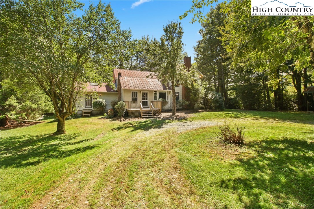 2166 George Hayes Road Boone, NC 28607 - Photo 6 of 50 a swimming pool with trees in the background