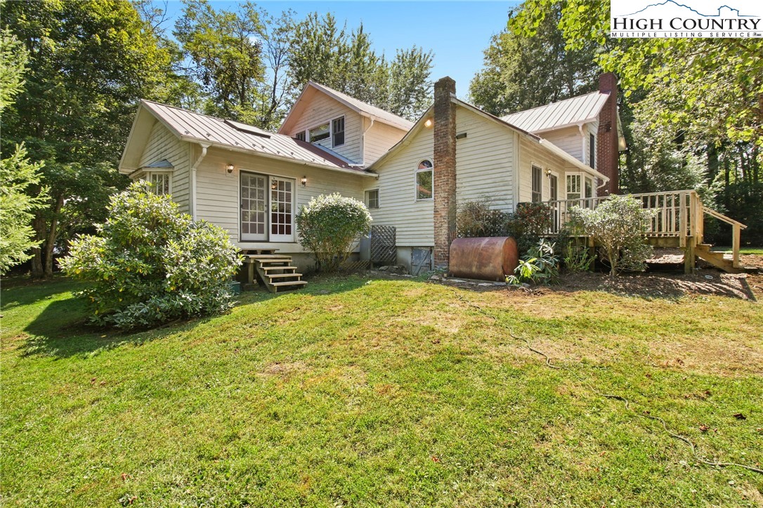 2166 George Hayes Road Boone, NC 28607 - Photo 7 of 50 a front view of a house with a yard and potted plants