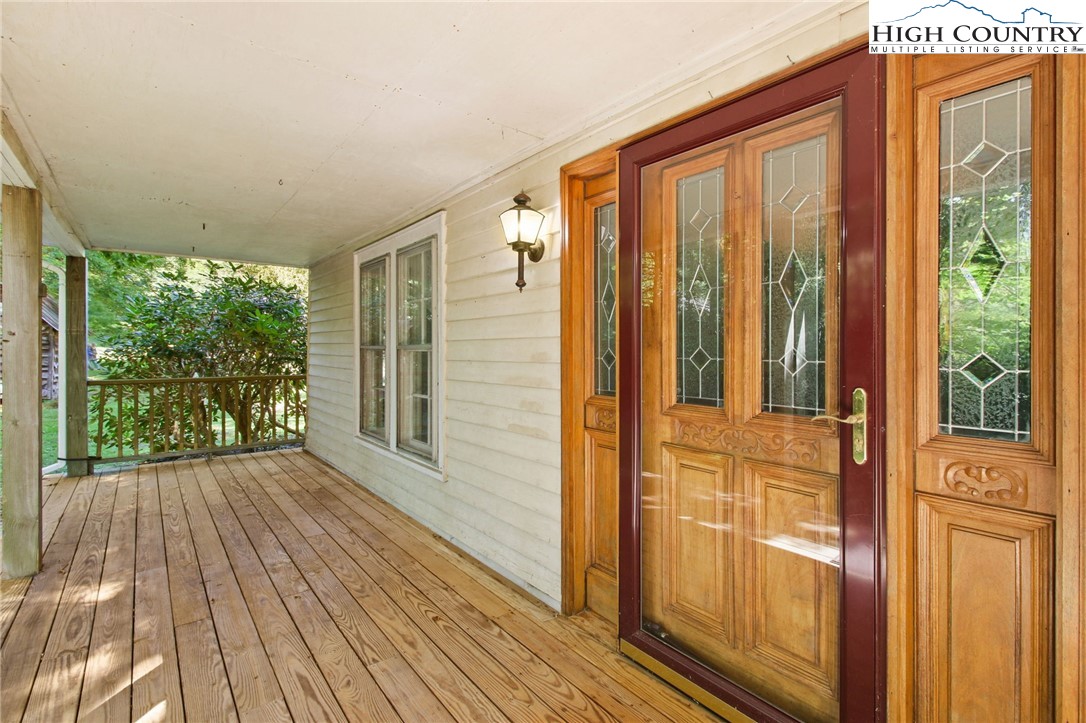2166 George Hayes Road Boone, NC 28607 - Photo 9 of 50 a view of a porch with wooden floor and doors