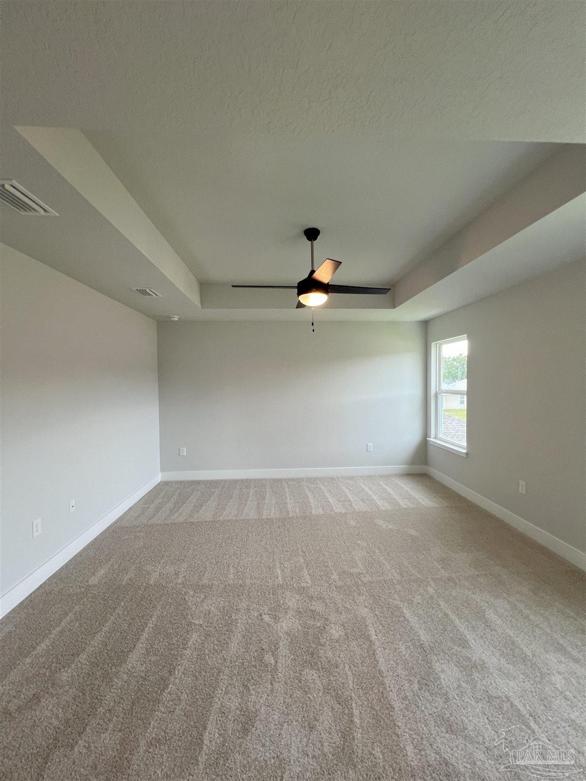 3339 Bliss Lane, Unit 9E Cantonment, FL 32533 - Photo 9 of 13 an empty room with a empty space and a window