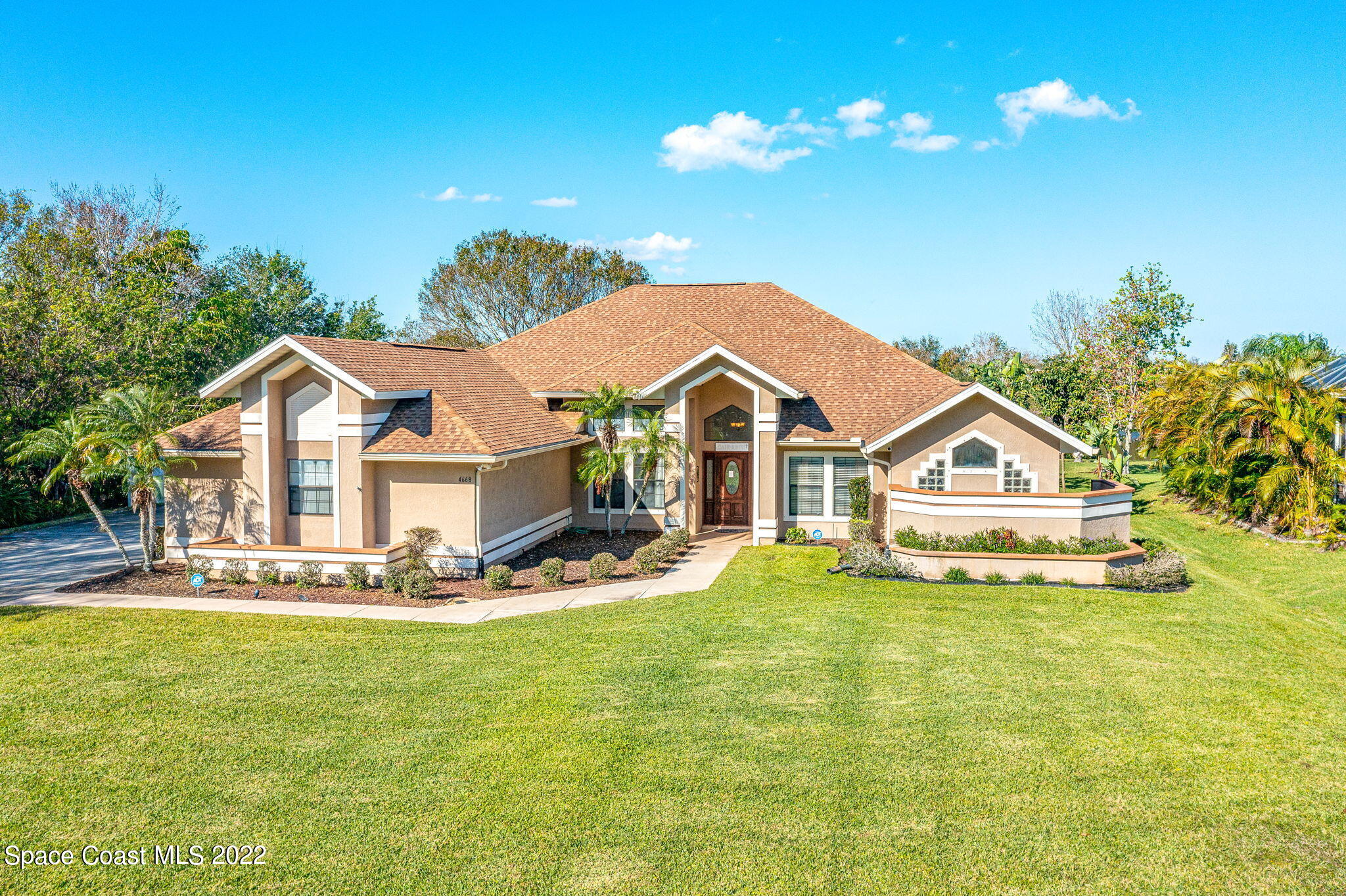 4668 Canard Road Melbourne, FL 32934 - Photo 1 of 29 a front view of a house with a yard