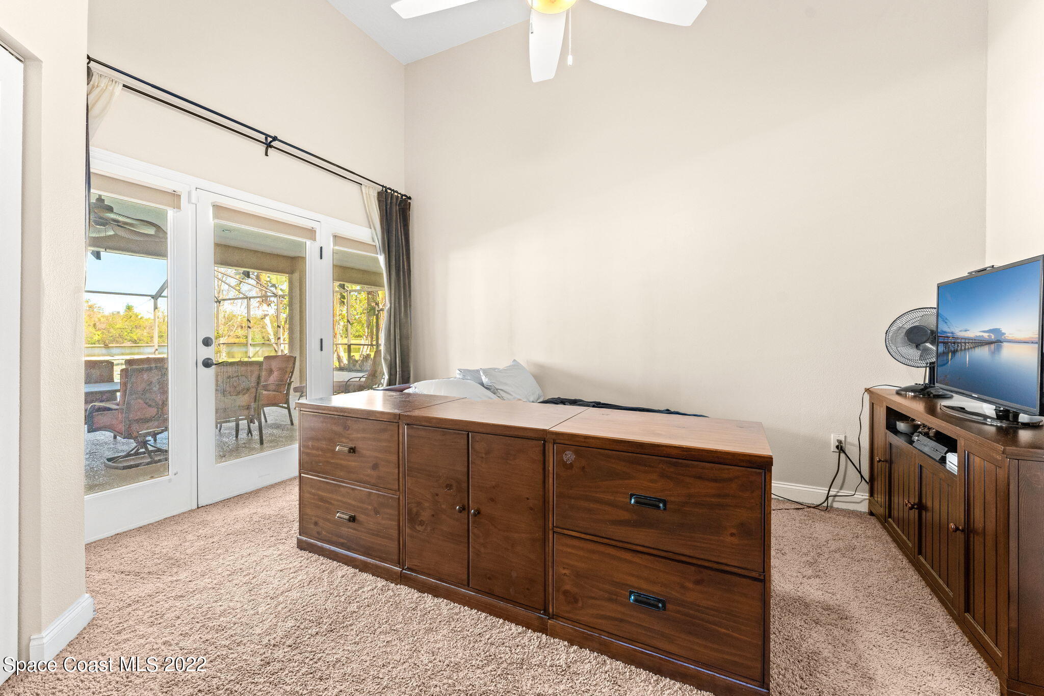 4668 Canard Road Melbourne, FL 32934 - Photo 12 of 29 a room with a bed and wooden floor
