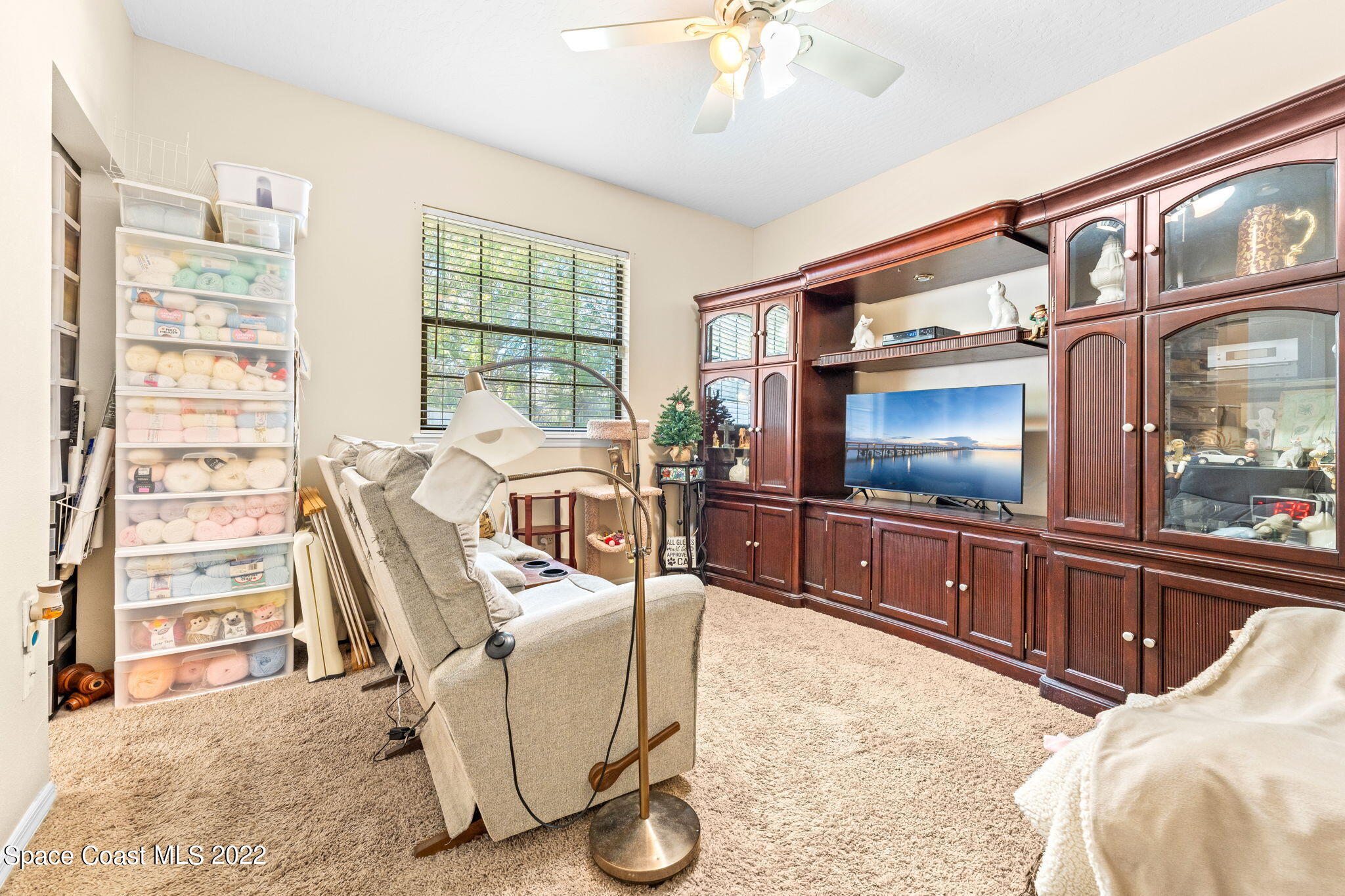 4668 Canard Road Melbourne, FL 32934 - Photo 13 of 29 a living room with furniture and a flat screen tv