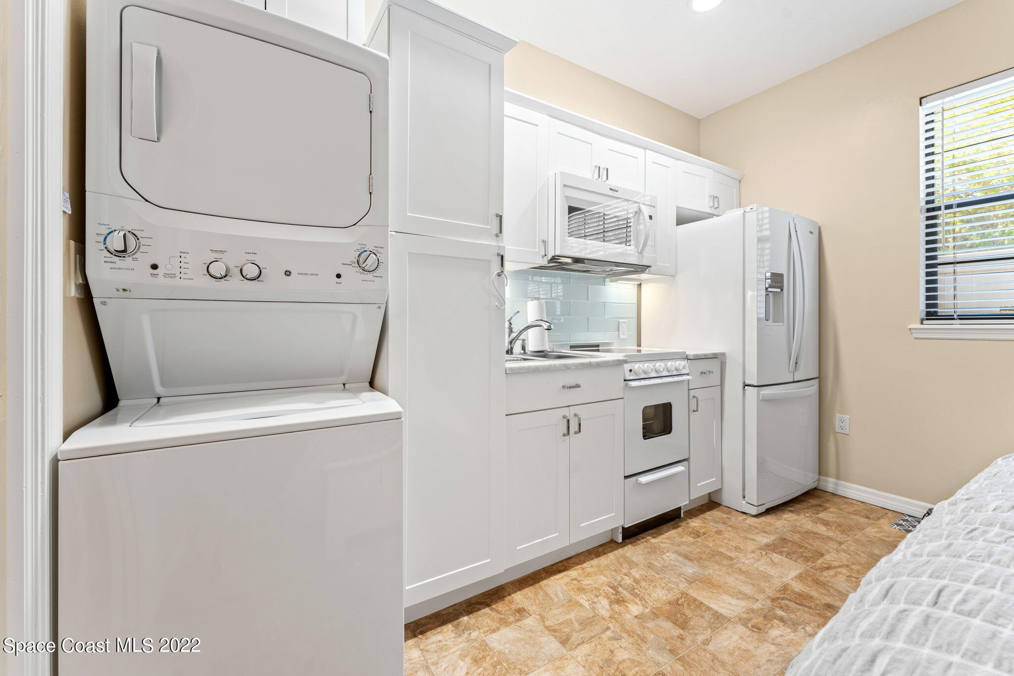 4668 Canard Road Melbourne, FL 32934 - Photo 15 of 29 a view of kitchen with washer and dryer