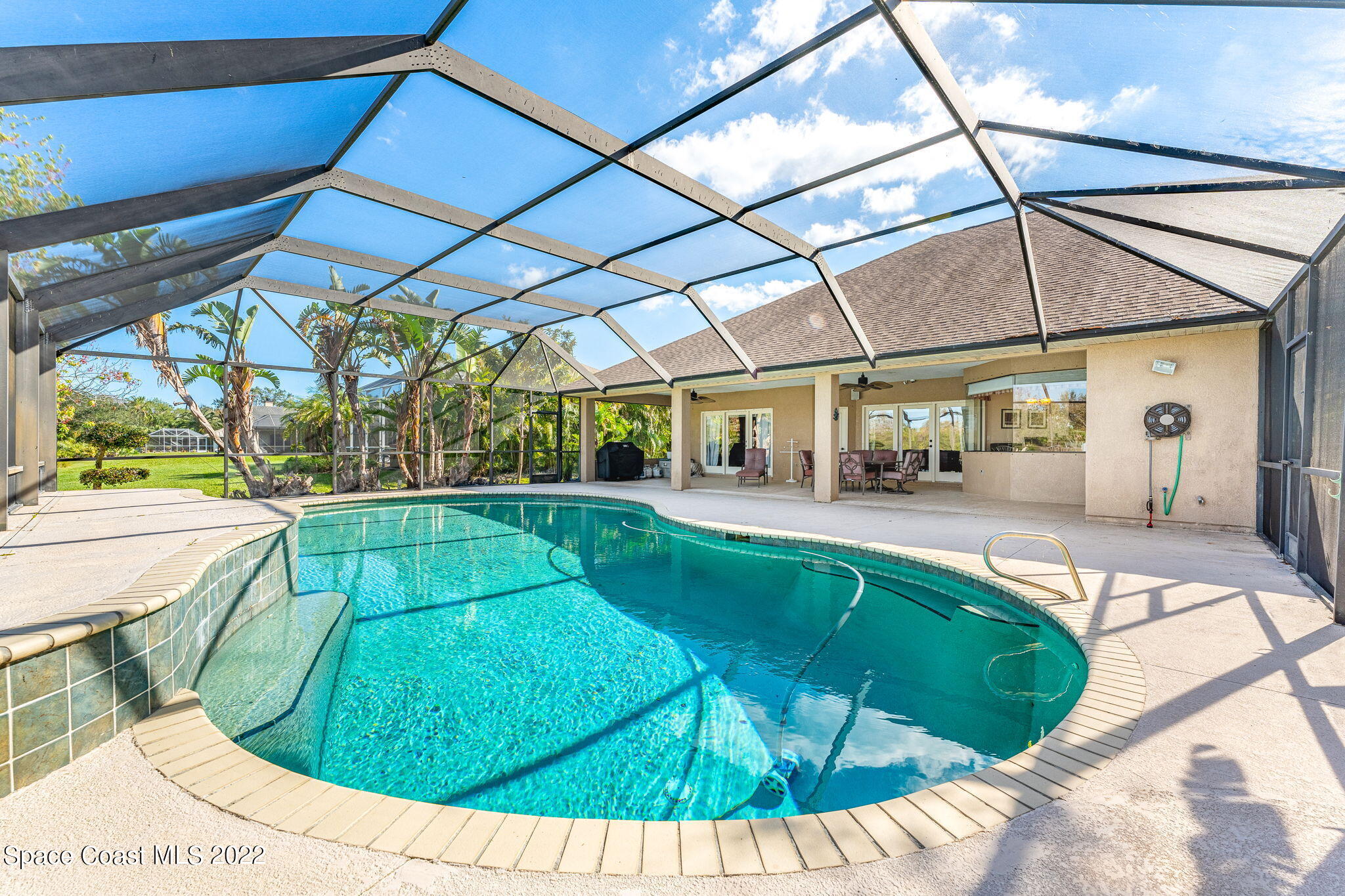 4668 Canard Road Melbourne, FL 32934 - Photo 18 of 29 a view of a swimming pool with a patio