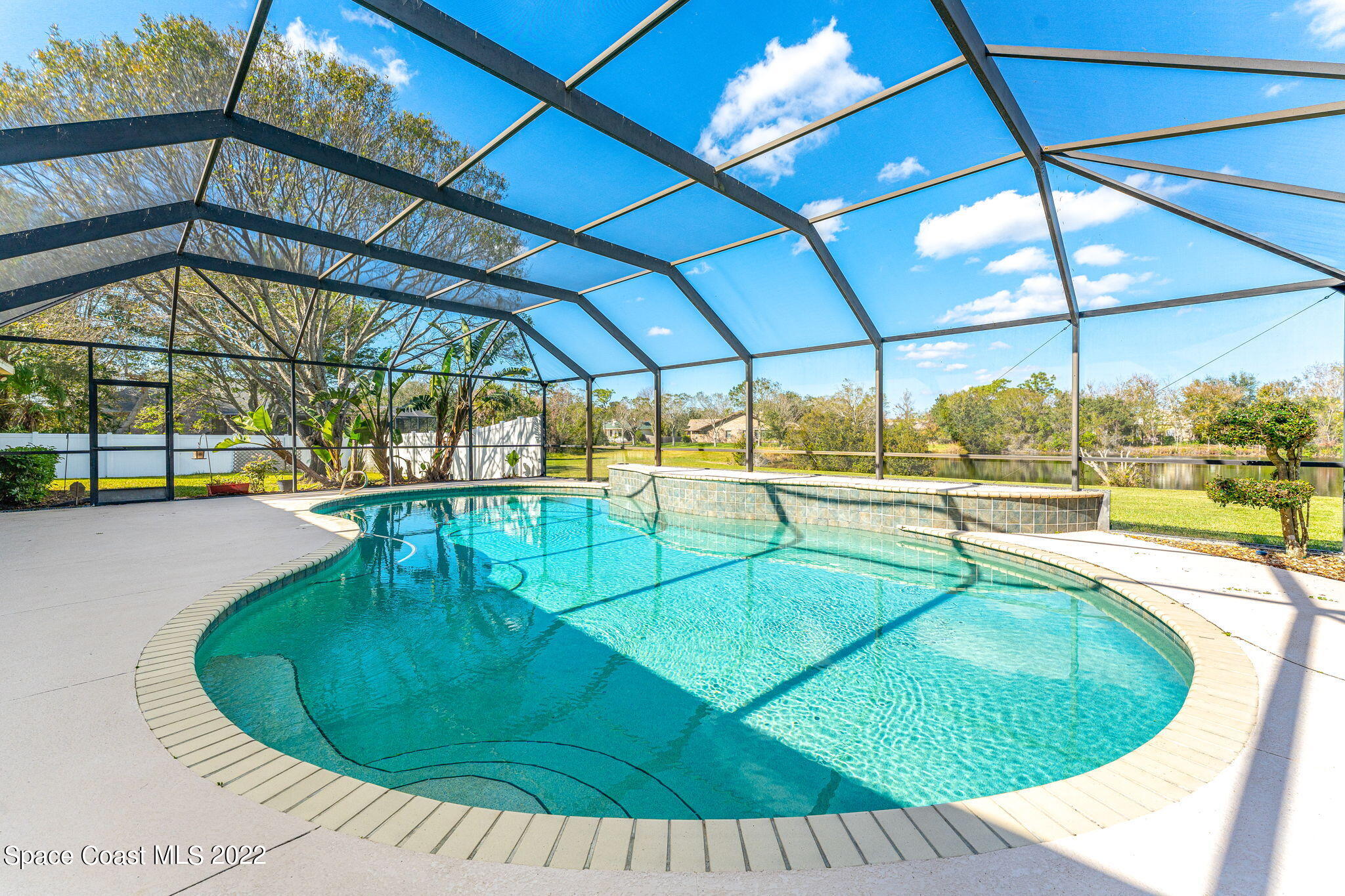 4668 Canard Road Melbourne, FL 32934 - Photo 19 of 29 a view of a swimming pool with seating area