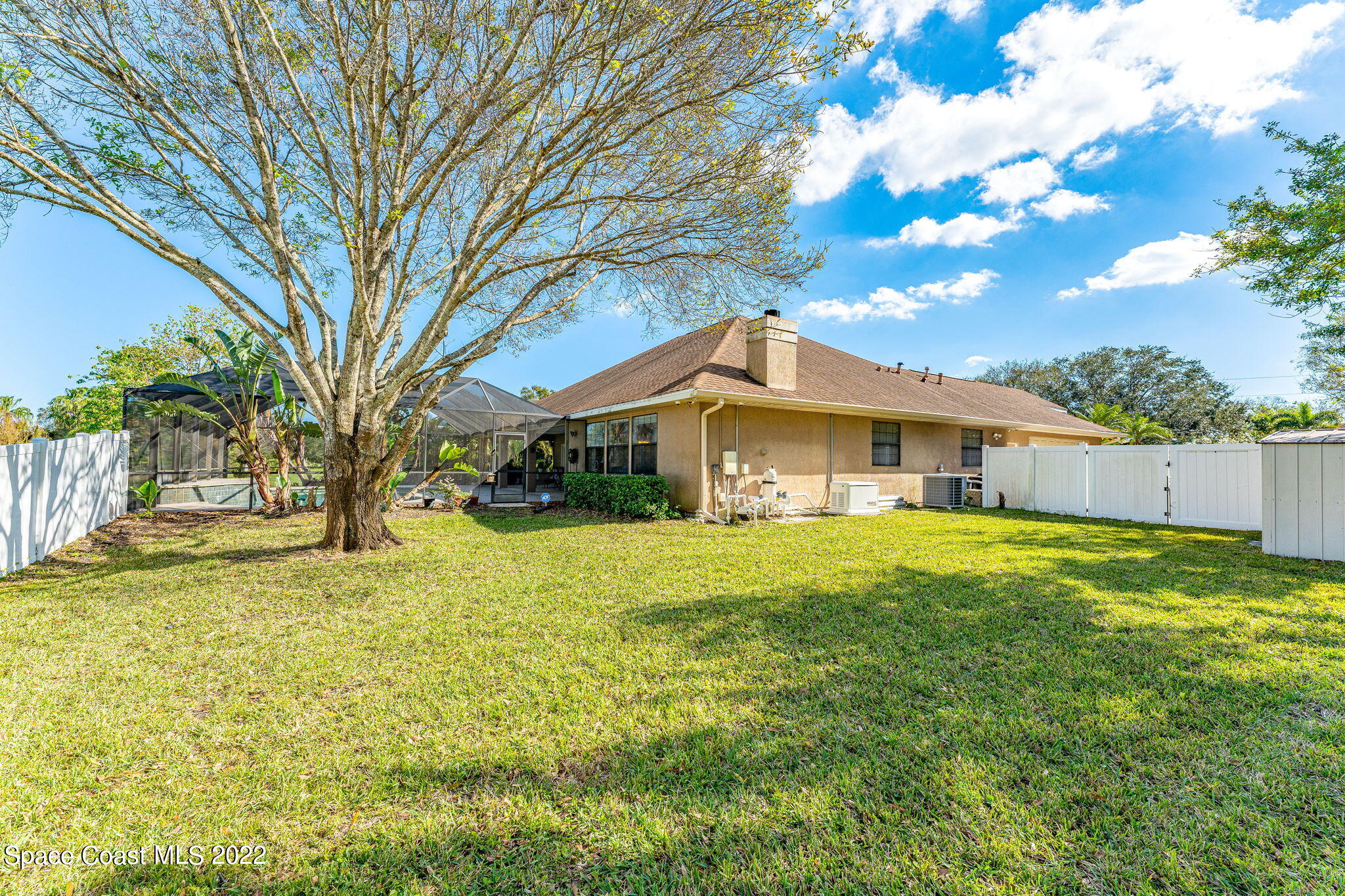 4668 Canard Road Melbourne, FL 32934 - Photo 21 of 29 a front view of house with yard and trees