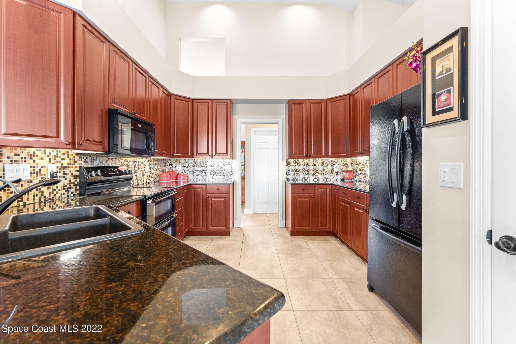 4668 Canard Road Melbourne, FL 32934 - Photo 5 of 29 a kitchen with stainless steel appliances granite countertop a refrigerator stove and sink