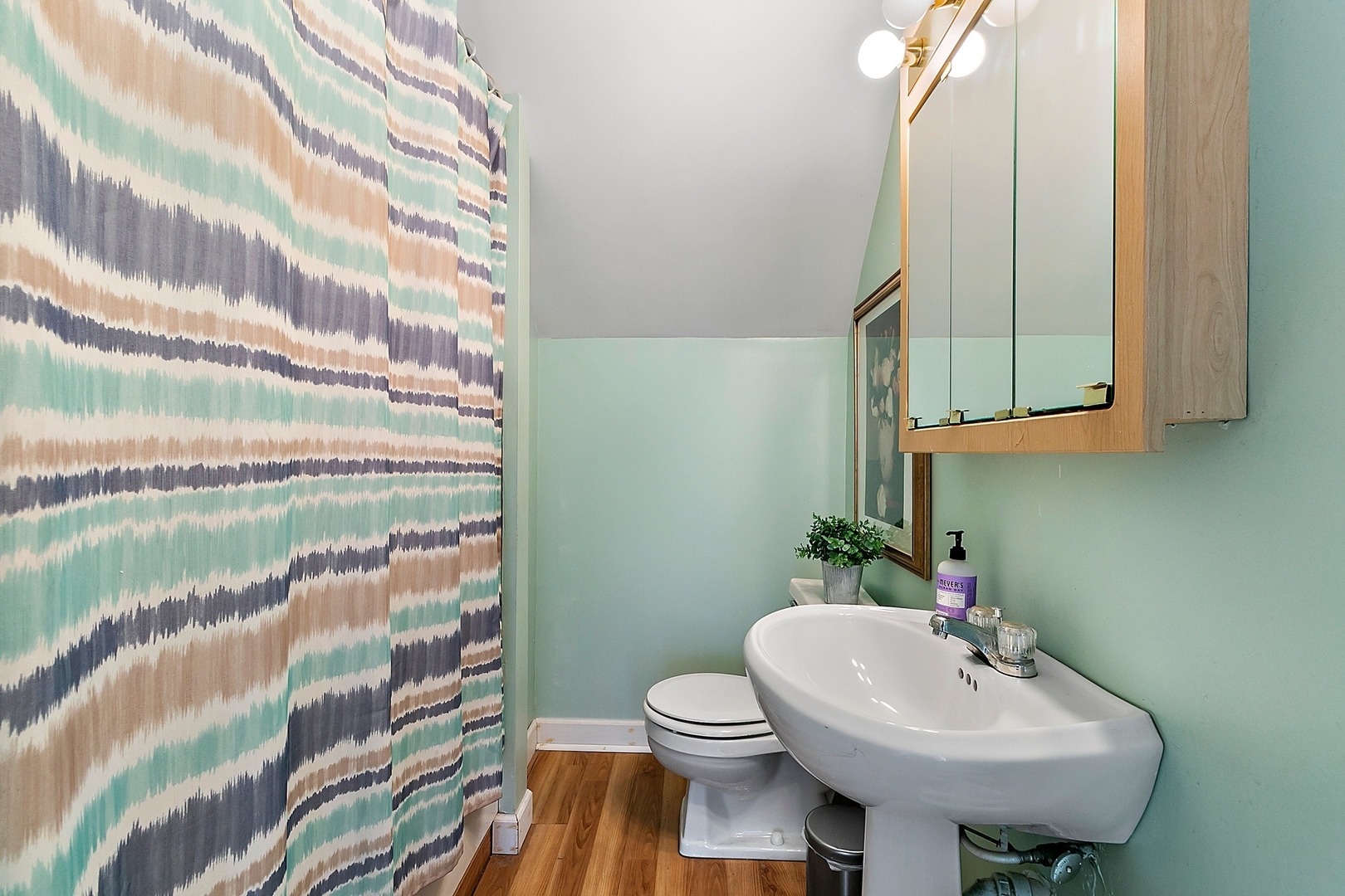 169 Barrypoint Road Riverside, IL 60546 - Photo 10 of 27 a bathroom with a sink and a mirror