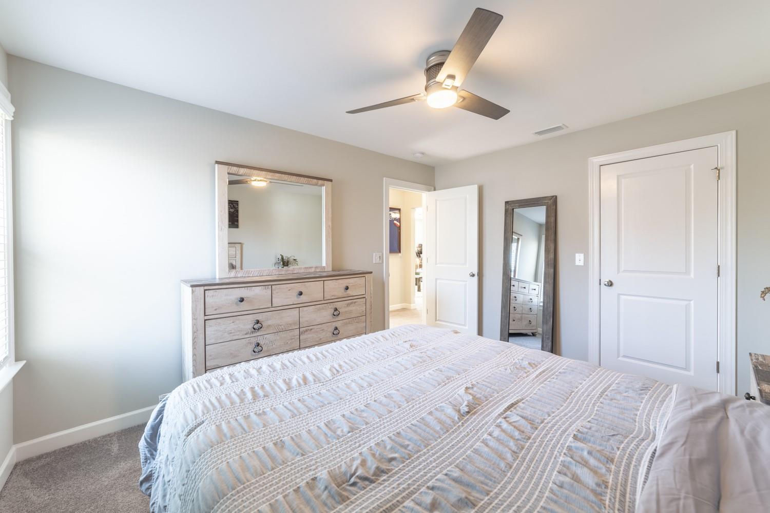 1280 West Rebound Road Lancaster, SC 29720 - Photo 26 of 34 a bedroom with a bed and a mirror