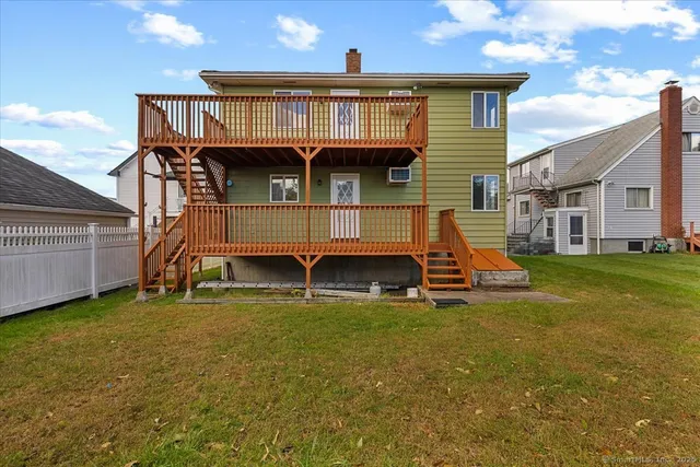 a view of house with a yard