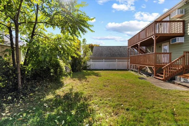 a view of a house with a backyard