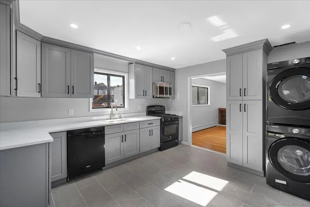 a kitchen with sink and cabinets