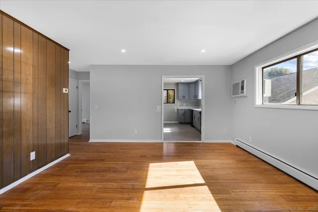 a view of livingroom with hardwood floor and hallway