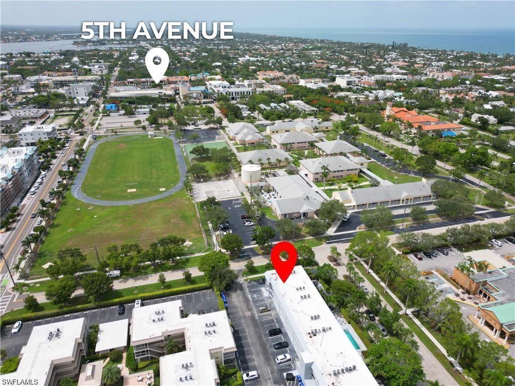 72 7th Street South, Unit 310 Naples, FL 34102 - Photo 18 of 20 an aerial view of residential houses with outdoor space