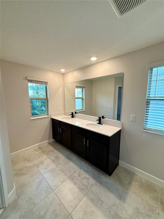 1421 Happy Bird Lane Winter Springs, FL 32708 - Photo 11 of 16 a living room with a dresser and a window