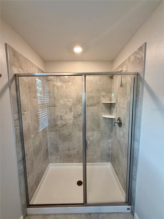1421 Happy Bird Lane Winter Springs, FL 32708 - Photo 13 of 16 a bathroom with a shower
