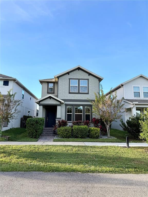 1421 Happy Bird Lane Winter Springs, FL 32708 - Photo 2 of 16 a front view of a house with a yard