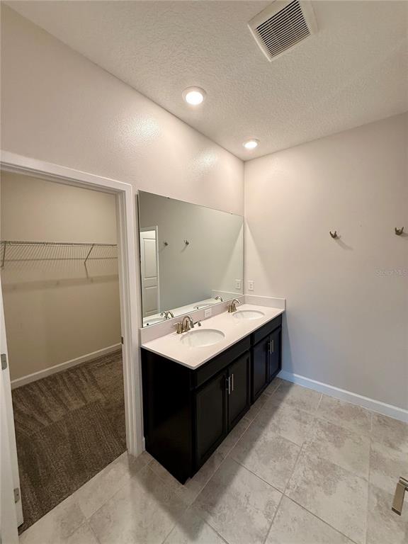 1421 Happy Bird Lane Winter Springs, FL 32708 - Photo 6 of 16 a bathroom with a sink and mirror