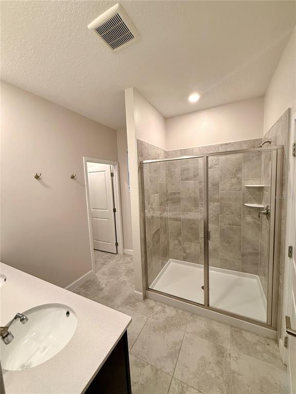 1421 Happy Bird Lane Winter Springs, FL 32708 - Photo 7 of 16 a bathroom with a shower and a sink