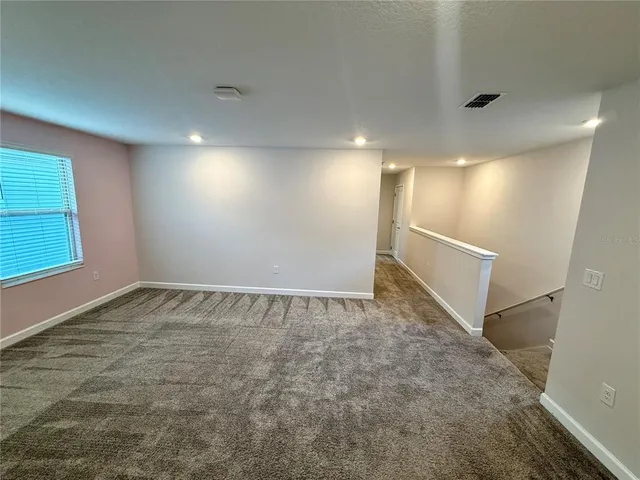 en empty room with windows