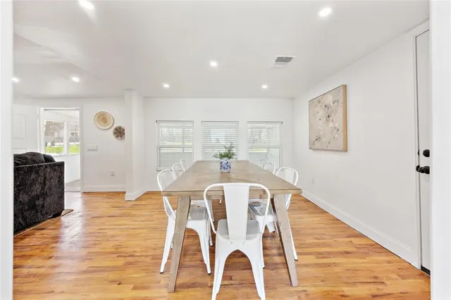 a view of a living room and dining room